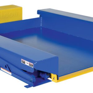 The blue industrial dock leveler with yellow edges, safety labels, and a power unit pairs with the Vestil Ground Lift Scissor Table 4K 52 X 73 to bridge gaps between docks and trucks, ensuring a stable loading and unloading platform.