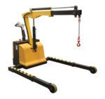 The Vestil Adjust Electric Powered Floor Crane 2.5K is a portable hydraulic lifting machine with a yellow base, black extended arms, and a red boom hook. It features two front wheels for mobility and comes with a handle for easy control.