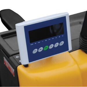 A close-up of the digital display panel on a yellow Vestil Electric Pallet Truck 3K-25X47 Scale Agm shows buttons with symbols. The screen is blank, surrounded by a black seat and metal framework, ideal for handling hefty loads with precision.