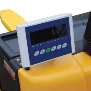 Close-up of a digital control panel on a yellow Vestil Electric Truck W/Scale Optional Printer. It includes a black screen and symbol-labeled buttons for precise scaling, with an armrest and joystick on the right against a white background.