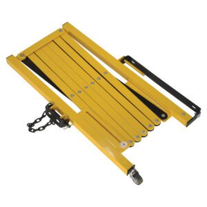 The yellow folding wheelchair ramp, akin to the Vestil Steel Expand-A-Gate Wall/Rack Mount, includes a black handle and small wheel. Interconnected panels secured with screws and a sturdy metal chain on one end provide reliable support.