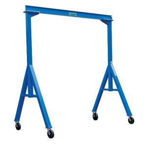 The Vestil Fixed Height Stl Gantry Crane 2K 10 Ft in blue has a horizontal beam, two triangular frames with four wheels each, and a level tool on top, making it ideal for lifting and moving heavy loads easily.