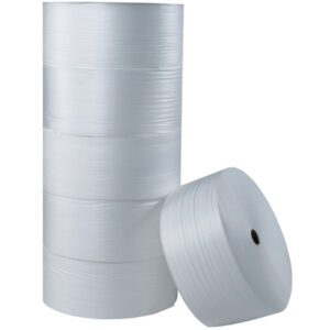 A pile of white pallet strapping is neatly arranged, with one roll resting against it. Each cylindrical roll, with a hollow core and textured surface, resembles the MH-USA 1/4 x 72 x 250 Air Foam Roll (250/Roll), perfect for securing packages and pallets.