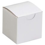 Against a neutral background, the unused plain white cardboard box resembles the MH-USA 2 x 2 x 2 White Gift Boxes. It features a closed, curved lid with flat sides and a semi-circular cutout, making it suitable for packaging.