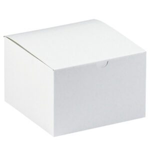 A plain white cardboard box with a closed lid against a white backdrop. The MH-USA 6 x 6 x 4 White Gift Boxes (100/Case) are square and simple, featuring a small notch on the front for easy opening.