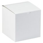 A plain MH-USA 7 x 7 x 7 white gift box with a slightly curved top sits against a white background, providing an elegant packaging option for special occasions. Available in cases of 100.
