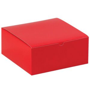 The MH-USA Holiday Red Gift Box features a bright red, square-shaped cardboard design with a small tab for easy opening. This 8 x 8 x 3 1/2 box is part of the 100/Case collection and sits against a plain white background, embodying classic style.