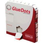 A box of 1/4 Medium Tack Glue Dots®, Low Profile (4000/Roll) comes in white and red packaging with branding and contact info, featuring a bottom opening for easy dispensing.
