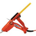 The 3M™ Poly Gun TC Glue Applicator showcases an orange design with a black trigger and pointed silver tip. It allows for easy yellow glue stick insertion at the back, while a black cord extends gracefully from the handle.