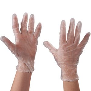 Two hands wearing medium MH-USA Vinyl Gloves - Clear - 3 Mil Powdered are shown against a white background, fitting comfortably and appearing slightly wrinkled.
