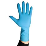 A raised hand wearing a bright blue latex glove, extending upward against a plain white background. The glove covers the wrist and forearm, with fingers spread apart.