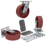 The Vestil 6X2 Ductile Steel Caster Kit 6K includes four red caster wheels with sturdy metal mounts and installation hardware like bolts and plates, all set against a white background. One wheel is elevated on its mount to display the underside.