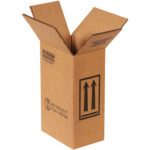 The plain white background showcases an open brown MH-USA 6 3/4 x 4 5/16 x 10 3/8 F-Style box with extended flaps, featuring printed symbols like an upward arrow and handling instructions. It is designed for easy storage of one-gallon containers.