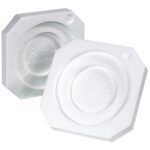 Two white, octagonal plastic caps with embossed text like Norwax International and Seal Side are designed to fit the MH-USA 1 Gallon Paint Can Foam Insert (100/Case) perfectly. They feature a central circular indentation and are displayed facing upward.