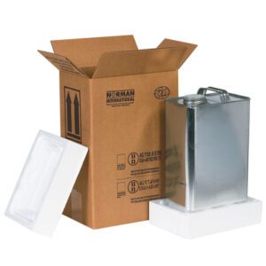 The Norman International cardboard box contains an MH-USA 1-Gallon F-Style Shipper Kit (90/Skid) measuring 8 3/16 x 5 11/16 x 12 3/8. A silver container with a convenient handle sits in styrofoam. The vertically open box ensures easy access.