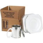 A cardboard box marked UN 4G Compliance Only When All Parts of Combination Package Are Used is beside a metal container with a lid and two white foam inserts, forming part of the MH-USA 5 1/8 x 5 1/8 x 6 3/16 - 1 Quart Foam Haz Mat Shipper Kit.