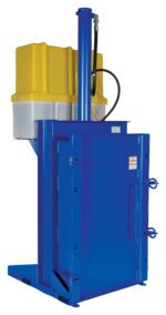 The blue industrial baler, resembling the Vestil Crusher/Compactor 460V, has a yellow and gray top, vertical hydraulic cylinder, rectangular chamber for compressing materials into bales, and various levers and connectors for efficient operation.