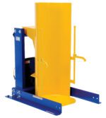 The Vestil Stationary Hyd Drum Dumper 1.5K 36 In is designed in blue and yellow, featuring a vertical cylindrical holder with safety handles for secure drum lifting and tilting, supported by a sturdy metal frame and base for handling heavy materials safely.