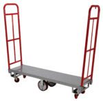 The Vestil High End Platform Truck 1.3K Lb Capacity has a steel platform with textured grip, two red vertical handles, and four wheels—two large central and two smaller swivel—for easy maneuverability, ideal for transporting heavy items effortlessly.