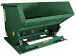 A green Vestil Self-Dump Light Duty Hopper 2 Cu Yd 2K features a slanted open top, sturdy base for easy loading/unloading, and several yellow safety warning labels on its sides.