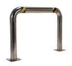 The silver safety barrier, similar to the Vestil Ss High Profile Rack Guard 48 x 36 x 4, has a U-shaped design with flat square bases for secure mounting and a top section adorned with black and yellow diagonal stripes.