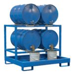 The blue metal rack, similar to the Vestil Horizontal Retention Basin 2400Lb - Blue, holds four blue industrial barrels—two on top and two below. Each lower barrel has a tap that dispenses liquid into gray buckets beneath.