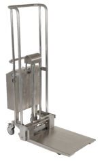 The silver Vestil Portable DC Pwr SS Hefti-Lift 22x25-3/4 is an industrial lifting device with a wheeled base, tall handles, and a flat platform. It features a mechanical lift system for efficient and safe load raising.