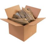 A cardboard box filled with crumpled brown packing paper contains a 24 x 167 roll of Expandable Versa-Pak™ Cellulose Wadding for added protection.