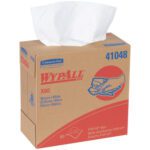 A cardboard pop-up box labeled Kimberly Clark® WypALL® X80 Heavy-Duty Wipers features red and blue branding, with a partially pulled white wiper visible. It includes 80 white wipers inside, each measuring 9.1 x 16.8.