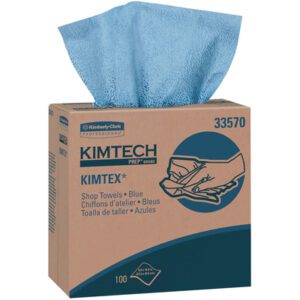 The Kimtech® Wipers Pop-Up Box, from a 5-case set, features premium blue shop towels with one towel peeking out. The box displays the brand logo and multilingual info, confirming there are 100 high-quality towels inside.