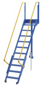 A blue industrial metal staircase with ten steps, featuring yellow safety handrails on both sides, resembles the 108 In Vestil Folding Mezzanine Ladder. Its small wheels imply portability and adjustability, making it ideal for versatile use.