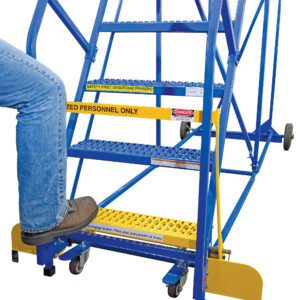 A person in jeans and boots steps onto a blue metal rolling ladder marked with yellow safety signs and AUTHORIZED PERSONNEL ONLY, secured by the Vestil Optional Warehouse Ladder Safety Gate.