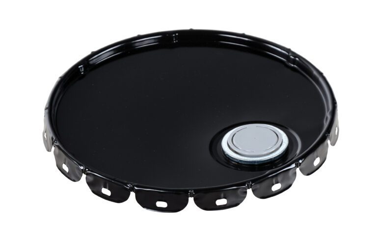 The Vestil Spout Top Steel Lid 5 Gallon Black is a round metal lid with serrated edges and a silver cap valve at the center-right, designed for secure sealing on 5-gallon drums. It is displayed against a white background.
