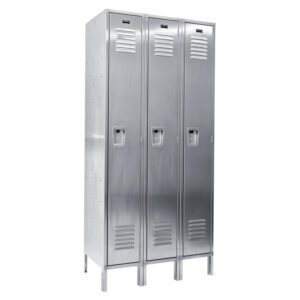 A row of three Vestil Locker-Ss 1 Row 3 Column 36 X 18 X 78 silver metal lockers with vented doors and handles, each standing on four legs, embodying a simple and functional design suitable for gyms or workplaces.
