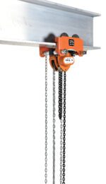 A 2000 kg orange Vestil Low Headroom Chain Hoist Trolley Gear hangs from an I-beam, using dual chains for lifting and operation, with a label showcasing its credentials for reliable overhead performance.