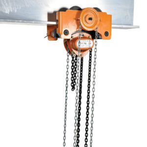 The Vestil Low Headroom Chain Hoist Trolley Gear 6K is mounted on a horizontal metal beam, featuring a black and silver chain system. Its vibrant orange design includes clear labeling and adjustment mechanisms for efficient control and enhanced safety with a 6K capacity.