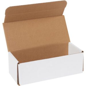 An angled view of a partially open MH-USA 9 x 4 x 3 White Corrugated Mailer reveals its brown interior. The empty box, set against a plain backdrop, highlights its durable design.