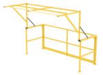The Vestil Mezzanine Safety Double Wide Gate is a yellow industrial gate with foldable overhead bars, a railing system, and diagonal support rods, creating a secure barrier for platforms or loading=