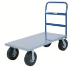 The Little Giant Cushion-Load Platform Truck with Pneumatic Tires has a blue handle, flat gray platform, and sturdy black pneumatic tires, making it ideal for moving heavy items in industrial or warehouse environments.