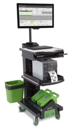 Newcastle-NB-430-s-1.jpg A mobile workstation with a monitor, computer, and printer on a wheeled cart. It features a green waste bin on the side, storage compartments, and green handheld scanning devices at the bottom.