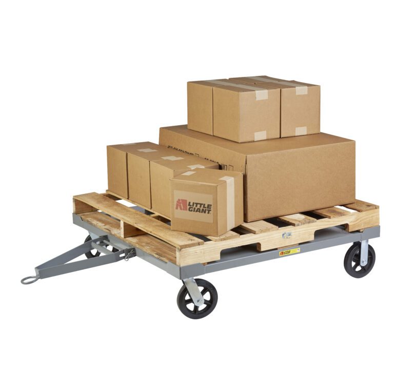 Little Giant Towable Solid Deck Pallet Dollies effortlessly transport various sizes of stacked cardboard boxes on a flat wooden pallet cart, secured with tape. Featuring a tow bar, these dollies ensure easy mobility for your cargo.