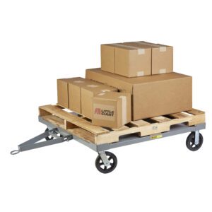 Little Giant Towable Solid Deck Pallet Dollies effortlessly transport various sizes of stacked cardboard boxes on a flat wooden pallet cart, secured with tape. Featuring a tow bar, these dollies ensure easy mobility for your cargo.