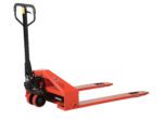 The Vestil Super Low Pallet Truck-2200 Lb 33 X 44, with a red metal frame and black handles/wheels, is ideal for lifting pallets. Featuring two long forks for easy load sliding and a slightly tilted back handle, it ensures comfortable manual maneuvering.
