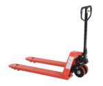A red Vestil Full Featured Pallet Truck 6K 27 X 48 with a black handle is shown diagonally in the image. It has two forks, small wheels for maneuvering palettes, and a visible hydraulic system near the handle.