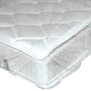 A close-up of a mattress wrapped in MH-USA Mattress Bags, showcasing its quilted top and stitching. The clear plastic highlights the white mattresss intricate design and texture, providing protection while maintaining visibility.