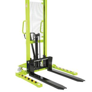 The Vestil Pramac Stacker features a green manual design with black forks and handles, adjustable forks and legs, a 2000 lb capacity, a mesh guard, a hydraulic lift mechanism for enhanced safety, and black/yellow stripes on a white background.
