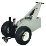 The Vestil Power Move Master 1K 53 X 37.5 X 37 is a compact, wheeled motorized vehicle with a triangular frame, large rubber tires, and hitch attachment for towing. It includes a handle for steering and is expertly designed to move heavy loads effortlessly.