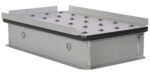 The Vestil Pop-Up Ball Transfer Platform, 19 x 32, is a rectangular gray metal unit with a flat perforated top featuring small domes. It includes side brackets and bolts, making it ideal for mechanical or engineering purposes.