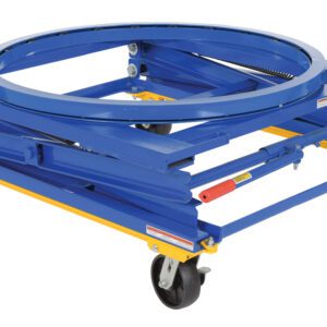 A blue and yellow industrial dolly, the Vestil Adjustable Pallet Stand Carousel Caster, has a metal ring on top and four swiveling caster wheels, featuring a sturdy metal bar framework to support heavy loads effortlessly.
