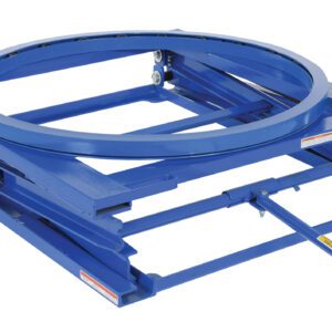The Vestil Adjustable Pallet Stand W/ Carousel 4K is a blue industrial turntable with a circular platform and rectangular base for rotating heavy objects, featuring a visible side handle with a red grip for seamless manual operation.